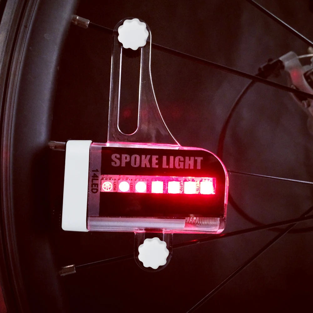 bike spoke lights close-up with red LEDs illuminated on wheel