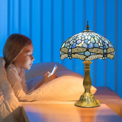 antique dragonfly stained glass lamp illuminating bedroom nightstand