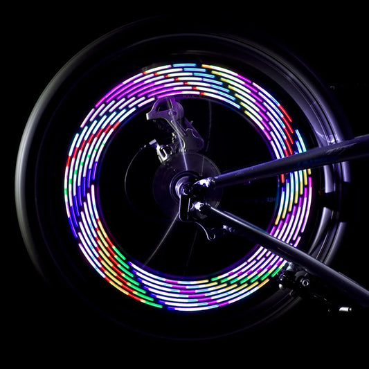 bike wheel lights RGB rainbow pattern spinning at night