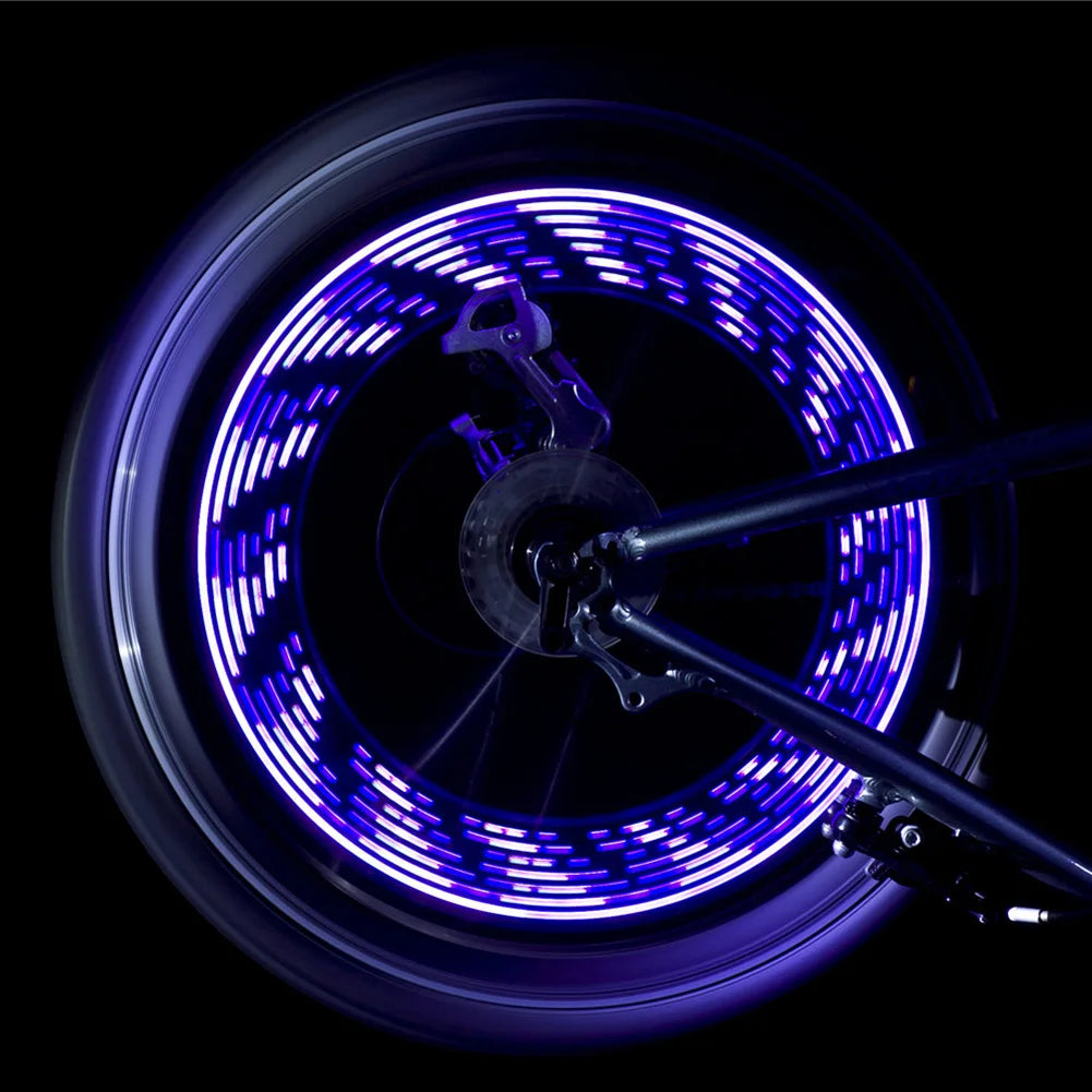led wheel lights blue concentric ring pattern on spinning bicycle wheel