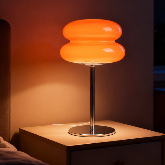 mini lamp glowing warm orange on modern nightstand