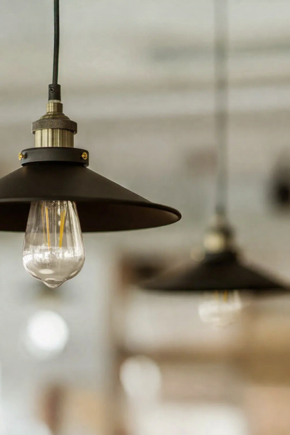 decorative led light bulbs hanging from industrial pendant fixtures