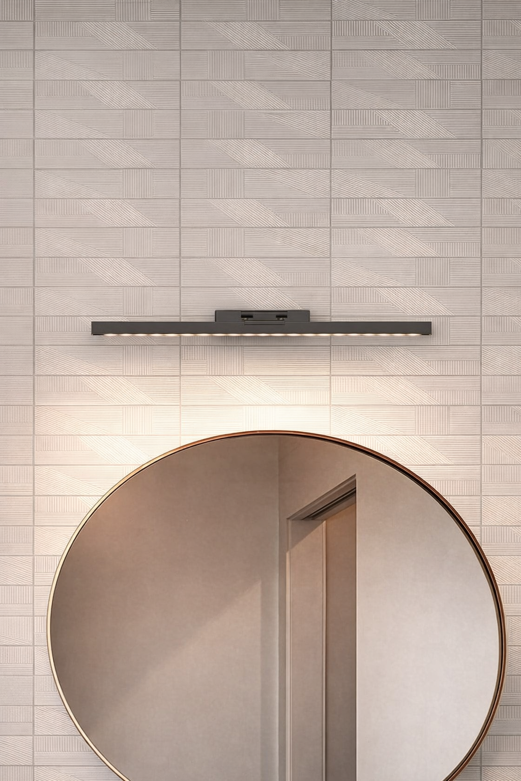 picture light casting warm wall washing glow over bathroom mirror