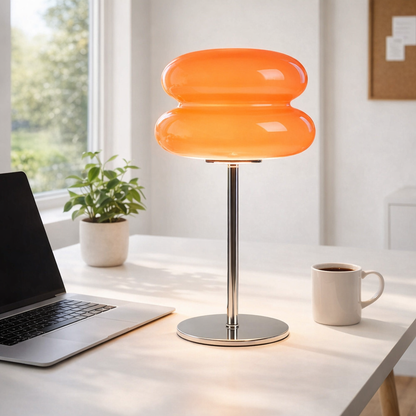 mini desk lamp on bright home office desk with laptop and plant